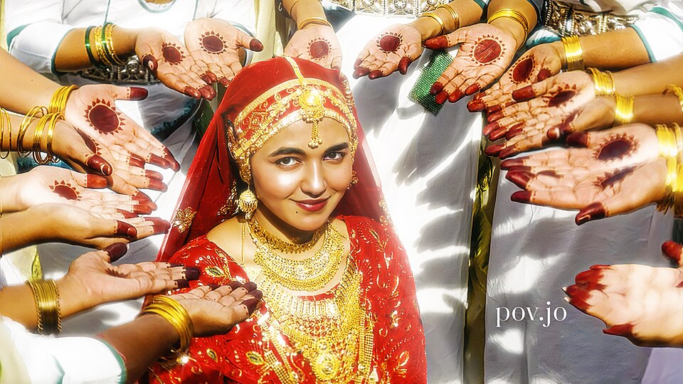 Young women performing Oppana, the traditional wedding dance traditionally synchronized to the rhythmic beats and poetic verses of Mappilappattu folklore.