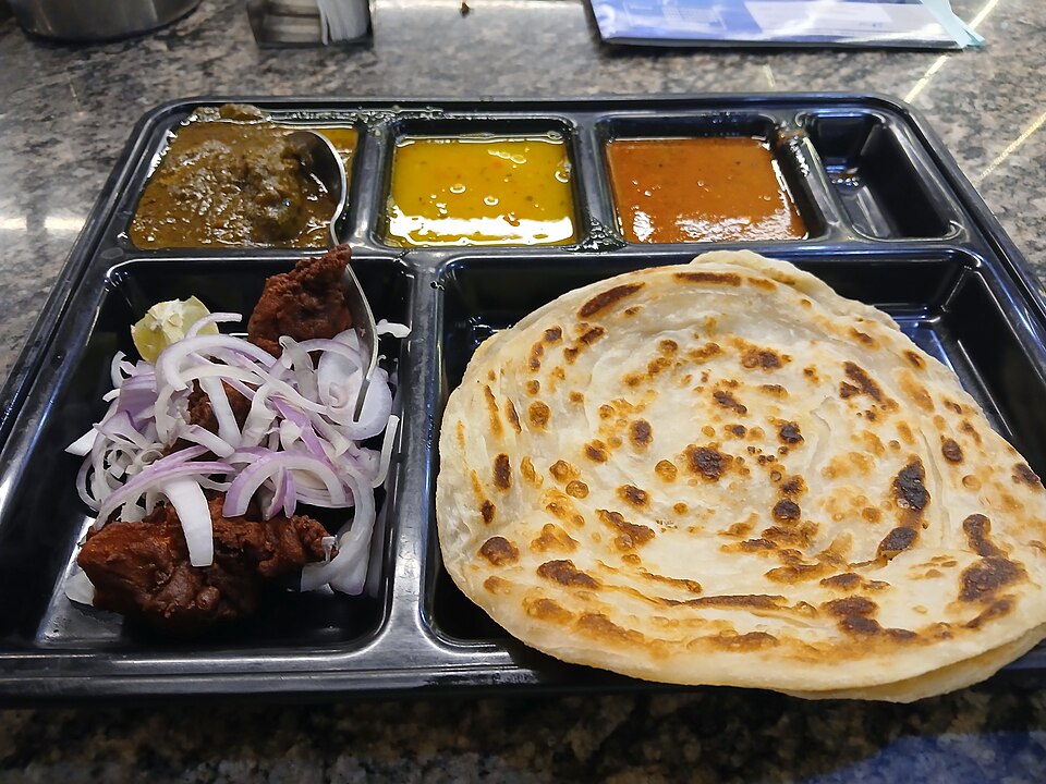 Malabar parotta and chicken Kerala -- the iconic layered flatbread with spiced Mappila chicken curry that is North Kerala definitive street food pairing