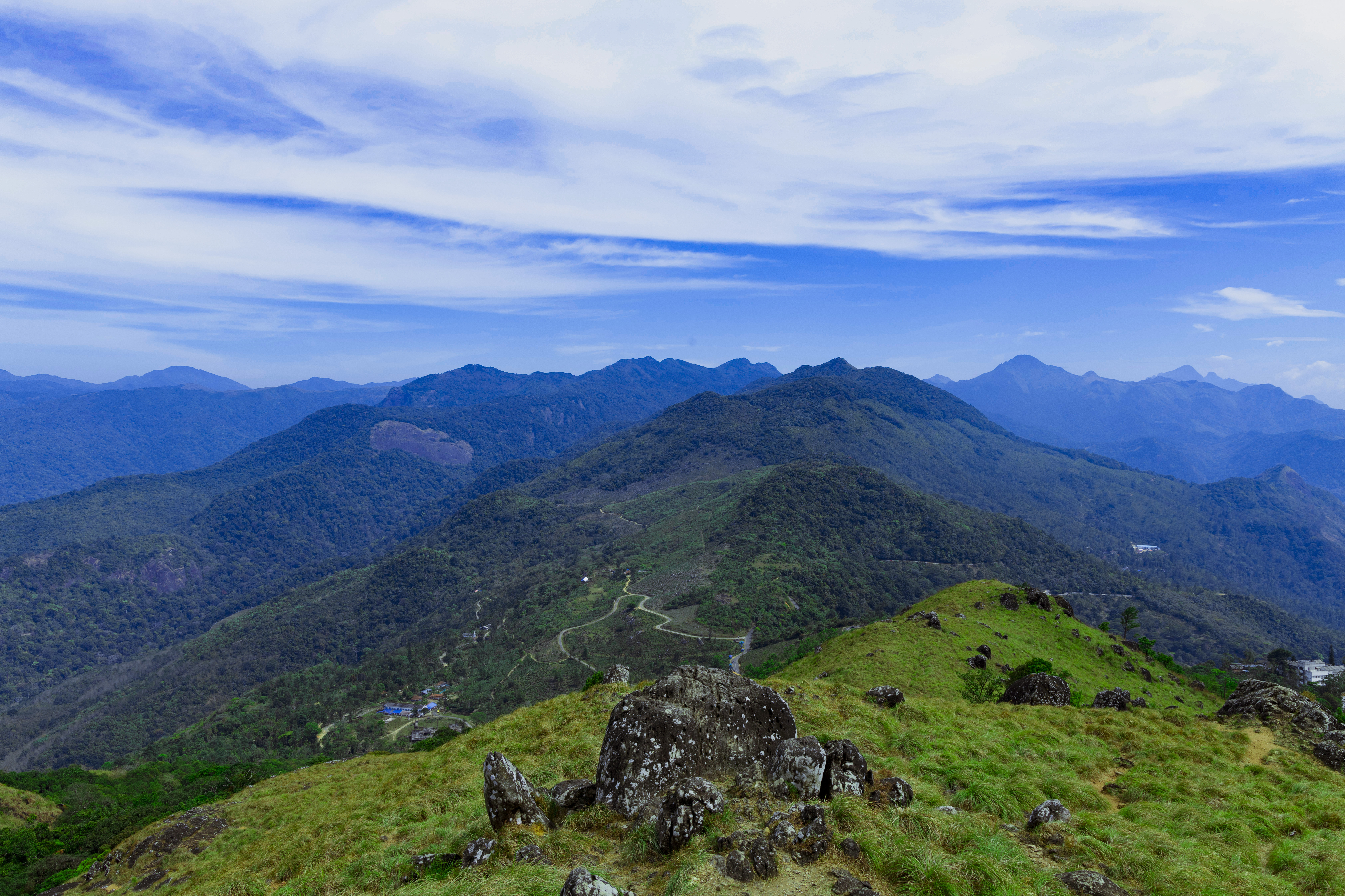 Ponmudi hill station near Thiruvananthapuram Kerala — mist-covered peaks and lush forest valleys of the Western Ghats above the state capital